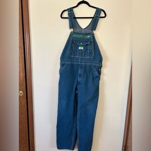 Liberty Blue Denim Overalls Size 36x30 with brass hardware and green accents